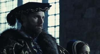 Movie still from “The Other Boleyn Girl” (2008), directed by Justin Chadwick – A man wearing a fur coat and a crown; Close Up shot, Over the shoulder angle
