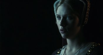 Movie still from “The Other Boleyn Girl” (2008), directed by Justin Chadwick – A young woman with long blonde hair wearing a necklace; Close Up shot, Low angle