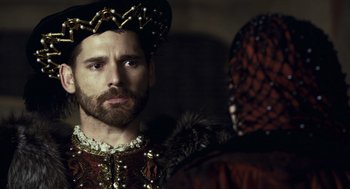 Movie still from “The Other Boleyn Girl” (2008), directed by Justin Chadwick – A bearded man in a medieval outfit looking at the camera; Close Up shot, Over the shoulder angle