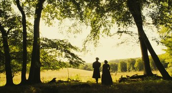 Movie still from “The Other Boleyn Girl” (2008), directed by Justin Chadwick – A man and a woman standing under a large tree; Extreme Wide shot, Low angle