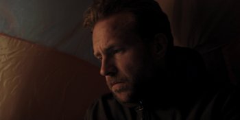 Movie still from “The Ritual” (2017), directed by David Bruckner – A person with a beard; Close Up shot, Low angle