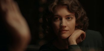 Movie still from “Guillermo del Toro's Cabinet of Curiosities” (2022), directed by Keith Thomas – A person with curly hair; Close Up shot, Over the shoulder angle