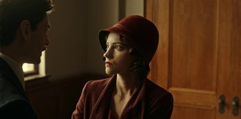 Movie still from “Guillermo del Toro's Cabinet of Curiosities” (2022), directed by Keith Thomas – A woman wearing a red hat looking to her left; Close Up shot, Low angle