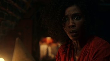 Movie still from “Guillermo del Toro's Cabinet of Curiosities” (2022), directed by Keith Thomas – A person wearing a red shirt; Close Up shot, Over the shoulder angle