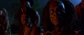 Movie still from “The Scorpion King” (2002), directed by Chuck Russell – A man with a dreadlock hair style; Close Up shot, Low angle