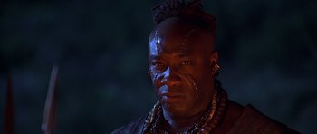 Movie still from “The Scorpion King” (2002), directed by Chuck Russell – A person wearing a necklace; Close Up shot, Low angle