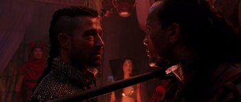 Movie still from “The Scorpion King” (2002), directed by Chuck Russell – Two men in medieval garb facing each other in a room; Close Up shot, Over the shoulder angle