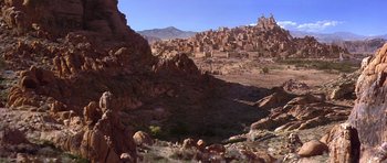 Movie still from “The Scorpion King” (2002), directed by Chuck Russell – A view of a city from the desert; Extreme Wide shot, High angle
