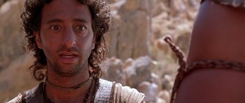 Movie still from “The Scorpion King” (2002), directed by Chuck Russell – A person with a beard; Close Up shot, Over the shoulder angle