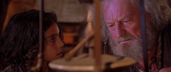 Movie still from “The Scorpion King” (2002), directed by Chuck Russell – An older man and a young girl looking at each other; Close Up shot, Over the shoulder angle