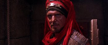 Movie still from “The Scorpion King” (2002), directed by Chuck Russell – A person wearing a head covering; Close Up shot, Over the shoulder angle