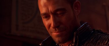 Movie still from “The Scorpion King” (2002), directed by Chuck Russell – A person wearing a necklace; Close Up shot, Over the shoulder angle