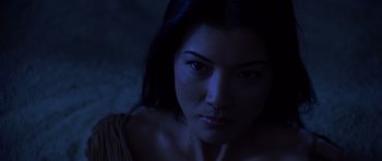Movie still from “The Scorpion King” (2002), directed by Chuck Russell – A woman's face in the dark; Close Up shot, Low angle