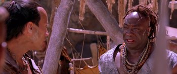 Movie still from “The Scorpion King” (2002), directed by Chuck Russell – A man standing in front of a tree with a bunch of ropes; Close Up shot, Over the shoulder angle