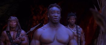 Movie still from “The Scorpion King” (2002), directed by Chuck Russell – A man with dreadlocks is standing next to another man with dreadlocks; Close Up shot, Low angle