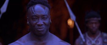 Movie still from “The Scorpion King” (2002), directed by Chuck Russell – A person with a face paint on; Close Up shot, Low angle