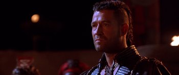 Movie still from “The Scorpion King” (2002), directed by Chuck Russell – A person wearing a leather jacket; Close Up shot, Low angle