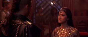 Movie still from “The Scorpion King” (2002), directed by Chuck Russell – A man and a woman are standing in front of each other; Close Up shot, Over the shoulder angle