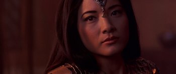 Movie still from “The Scorpion King” (2002), directed by Chuck Russell – A person wearing a necklace; Close Up shot, Over the shoulder angle