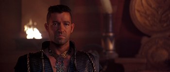 Movie still from “The Scorpion King” (2002), directed by Chuck Russell – A person wearing a necklace; Close Up shot, Over the shoulder angle