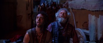 Movie still from “The Scorpion King” (2002), directed by Chuck Russell – Two men in medieval garb looking up at the sky; Medium shot, Low angle