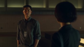 Movie still from “The Silent Sea” (2021), created by Choi Hang-Yong – A man and a woman are standing in front of each other; Medium shot, Over the shoulder angle