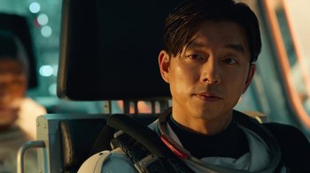 Movie still from “The Silent Sea” (2021), created by Choi Hang-Yong – A person sitting in a car; Close Up shot, Over the shoulder angle