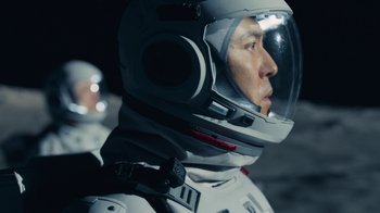 Movie still from “The Silent Sea” (2021), created by Choi Hang-Yong – A person wearing a space suit; Close Up shot, Low angle