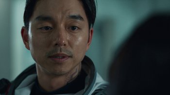 Movie still from “The Silent Sea” (2021), created by Choi Hang-Yong – A person wearing a space suit; Close Up shot, Over the shoulder angle