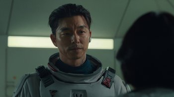Movie still from “The Silent Sea” (2021), created by Choi Hang-Yong – A person wearing a space suit; Close Up shot, Over the shoulder angle