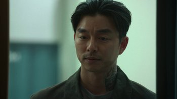 Movie still from “The Silent Sea” (2021), created by Choi Hang-Yong – A person with a tattoo on his face; Close Up shot, High angle