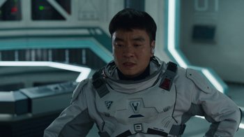 Movie still from “The Silent Sea” (2021), created by Choi Hang-Yong – A man in a spacesuit looking down at his face; Close Up shot, Over the shoulder angle