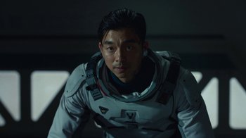 Movie still from “The Silent Sea” (2021), created by Choi Hang-Yong – A person wearing a space suit; Close Up shot, Over the shoulder angle