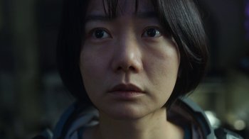 Movie still from “The Silent Sea” (2021), created by Choi Hang-Yong – A person with short hair; Close Up shot, Over the shoulder angle