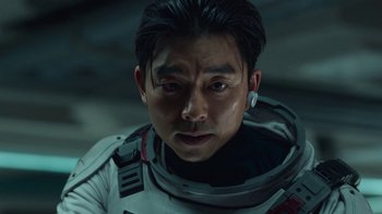 Movie still from “The Silent Sea” (2021), created by Choi Hang-Yong – A person wearing a space suit; Close Up shot, Over the shoulder angle