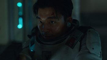 Movie still from “The Silent Sea” (2021), created by Choi Hang-Yong – A person wearing a helmet; Close Up shot, Low angle