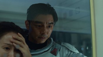 Movie still from “The Silent Sea” (2021), created by Choi Hang-Yong – A person wearing a space suit; Close Up shot, Over the shoulder angle
