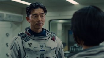Movie still from “The Silent Sea” (2021), created by Choi Hang-Yong – A man in a space suit talking to a woman; Close Up shot, Over the shoulder angle
