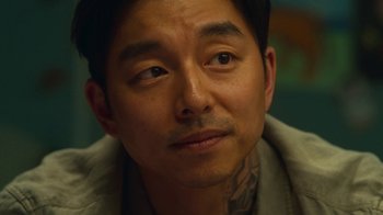 Movie still from “The Silent Sea” (2021), created by Choi Hang-Yong – A person with a tattoo on his face; Close Up shot, High angle