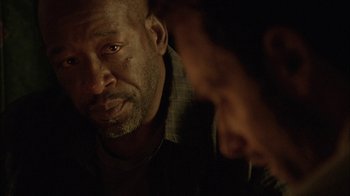 Movie still from “The Walking Dead” (2010), directed by Daniel Sackheim – A man and a woman looking at one another in the dark; Close Up shot, Over the shoulder angle