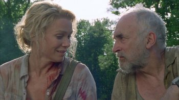 Movie still from “The Walking Dead” (2010), directed by Daniel Sackheim – A woman and an older man talking to each other; Close Up shot, Over the shoulder angle