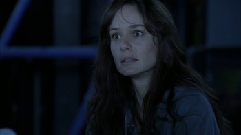 Movie still from “The Walking Dead” (2010), directed by Daniel Sackheim – A person with long brown hair; Close Up shot, Over the shoulder angle