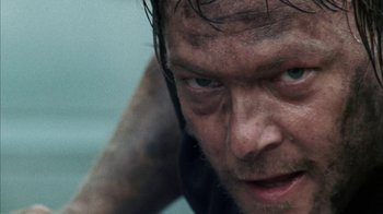 Movie still from “The Walking Dead” (2010), directed by Daniel Sackheim – A man's face with wet hair; Extreme Close Up shot, Low angle