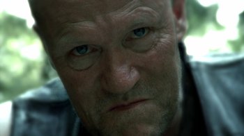 Movie still from “The Walking Dead” (2010), directed by Daniel Sackheim – A man's face with blue eyes; Close Up shot, Low angle