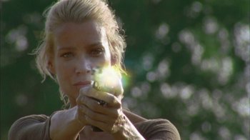 Movie still from “The Walking Dead” (2010), directed by Daniel Sackheim – A woman holding a cell phone in her hand; Close Up shot, Low angle