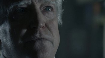 Movie still from “The Walking Dead” (2010), directed by Daniel Sackheim – An old man with a white beard and blue eyes looking at the camera; Extreme Close Up shot, Over the shoulder angle
