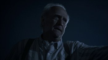 Movie still from “The Walking Dead” (2010), directed by Daniel Sackheim – An old man with a beard is looking at the camera; Close Up shot, Low angle