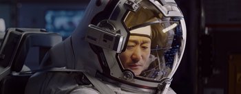 Movie still from “The Wandering Earth” (2019), directed by Frant Gwo – A man in a space suit looking into a mirror; Close Up shot, Low angle