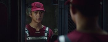 Movie still from “The Wandering Earth” (2019), directed by Frant Gwo – A man wearing a red hat looking into a mirror; Close Up shot, Over the shoulder angle