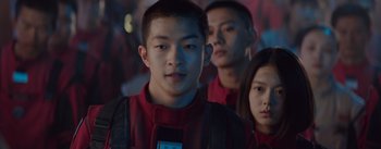 Movie still from “The Wandering Earth” (2019), directed by Frant Gwo – A group of young people standing next to each other; Close Up shot, Over the shoulder angle